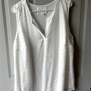 White sleeveless tunic with dot detail on front